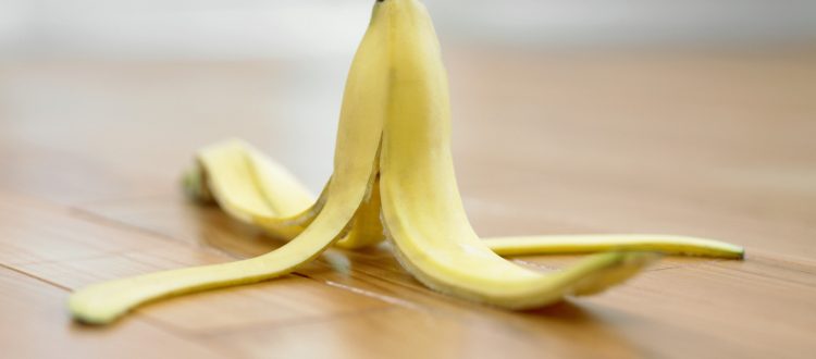 Banana peel on wooden floor
