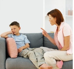 Mother giving out to her son