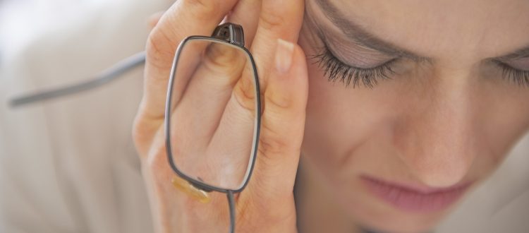 Closeup on stressed business woman with eyeglasses